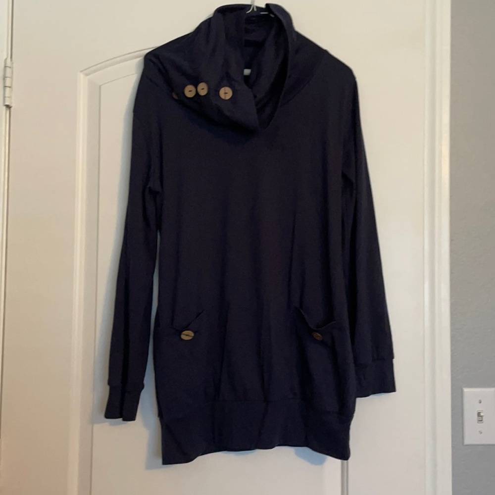 A large navy blue Levaca sweater with pockets